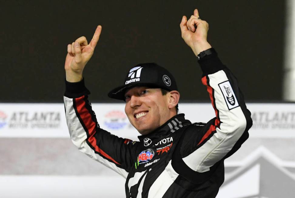 Kyle Busch celebrates after winning the NASCAR Truck Series auto race at Atlanta Motor Speedway, Saturday, Feb. 23, 2019, in Hampton, Ga. (AP Photo/John Amis)