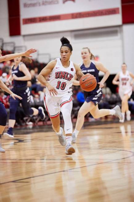 UNLV point guard Nikki Wheatley plays against Utah State on Feb. 2 at Cox Pavilion. Courtesy of UNLV Photo Services.