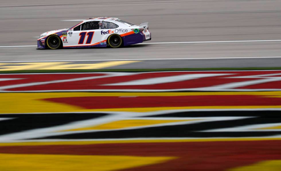 Denny Hamlin drives during qualifying for the NASCAR Cup Series auto race at Las Vegas Motor Speedway, Friday, March 1, 2019, in Las Vegas. (AP Photo/John Locher)