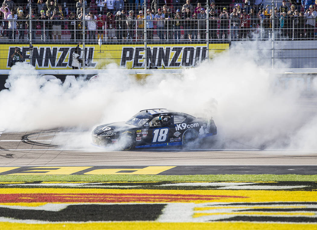 Kyle Busch (18) celebrates with a burnout after winning the NASCAR Xfinity Series Boyd Gaming 300 on Saturday, March 2, 2019, at Las Vegas Motor Speedway, in Las Vegas. (Benjamin Hager Review-Jour ...