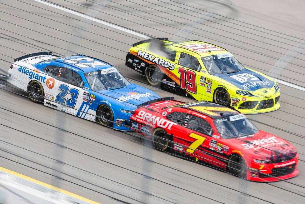 John Hunter Nemechek (23), Brandon Jones (19) and Austin Allgaier (7) race around turn one during the NASCAR Xfinity Series Boyd Gaming 300 on Saturday, March 2, 2019, at Las Vegas Motor Speedway ...