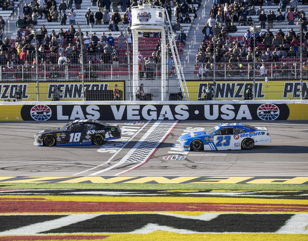 Kyle Busch (18) leads John Hunter Nemechek (23) in the final laps of the Boyd Gaming 300 on Saturday, March 2, 2019, at Las Vegas Motor Speedway, in Las Vegas. Busch won the 23rd annual running of ...
