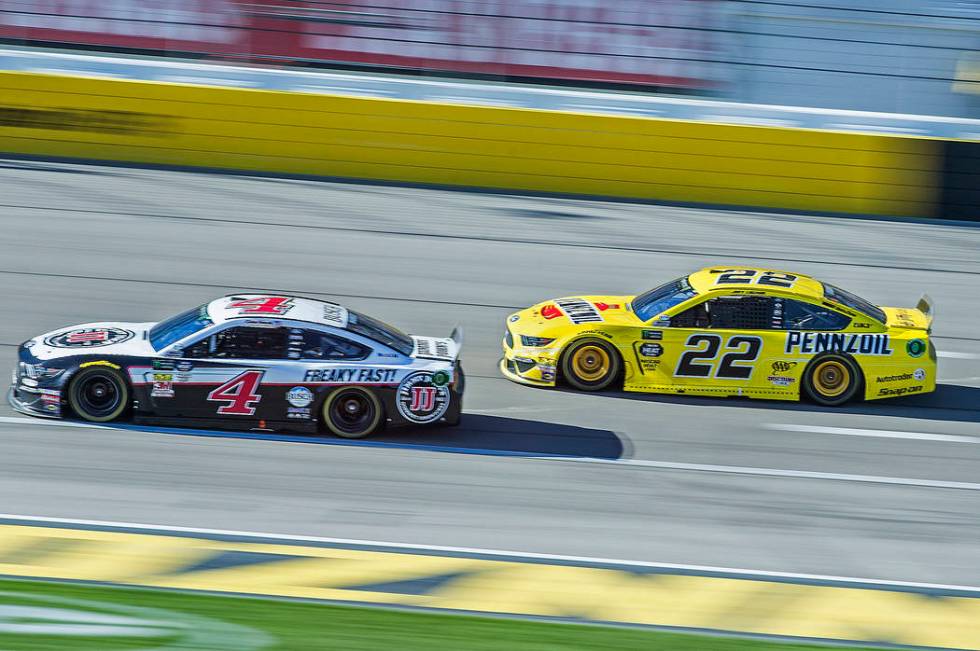 Joey Logano (22) and Kevin Harvick (4) fight for position in the final laps of the Monster Energy NASCAR Cup Series Pennzoil 400 on Sunday, March 3, 2019, at Las Vegas Motor Speedway, in Las Vegas ...