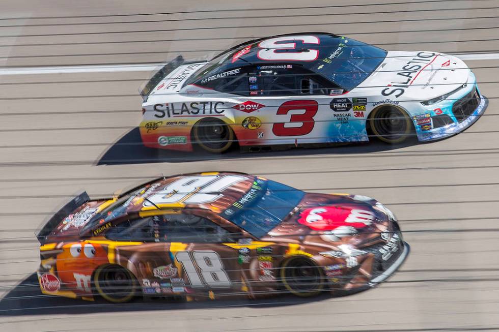 Kyle Busch (18) and Austin Dillon (3) compete for position around turn one during the Monster Energy NASCAR Cup Series Pennzoil 400 on Sunday, March 3, 2019, at Las Vegas Motor Speedway, in Las Ve ...