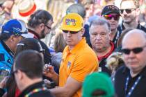 Kyle Busch, middle, signs autographs before the start of the Monster Energy NASCAR Cup Series Pennzoil 400 on Sunday, March 3, 2019, at Las Vegas Motor Speedway, in Las Vegas. (Benjamin Hager Revi ...