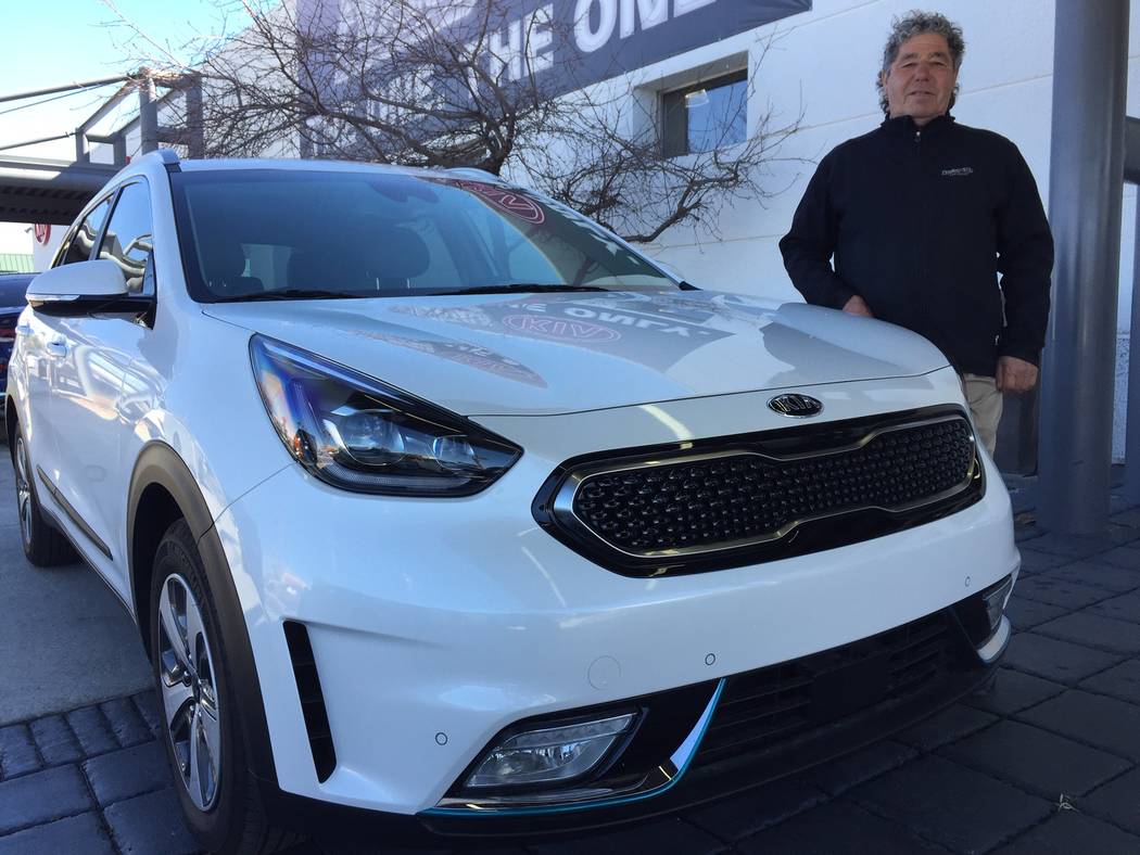 Findlay Kia sales consultant Tommy Gougou Stamos is seen with a 2019 Kia Niro at the dealership located at 5325 W. Sahara Ave. (Findlay)