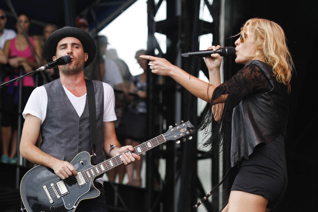 Metric's Emily Haines, left, and James Shaw perform at the Austin City Limits Music Festival, Saturday, Oct. 13, 2012, in Austin, Texas.(Photo by Jack Plunkett/Invision/AP)