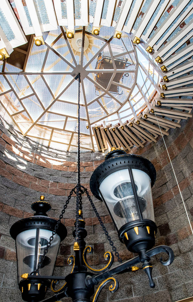 A city street lamp swings in the center of the staircase below the observation deck. (Tonya Harvey Real Estate Millions)