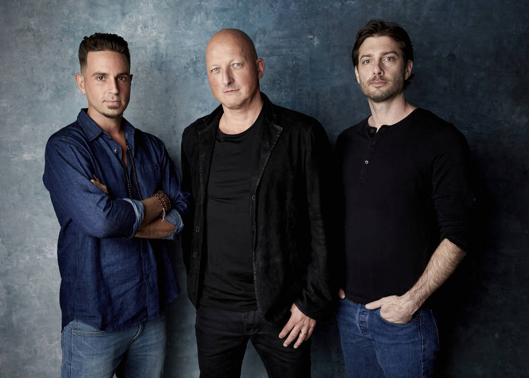 In this Jan. 24, 2019, file photo, Wade Robson, from left, director Dan Reed and James Safechuck pose for a portrait to promote the film "Leaving Neverland" during the Sundance Film Festival in Pa ...
