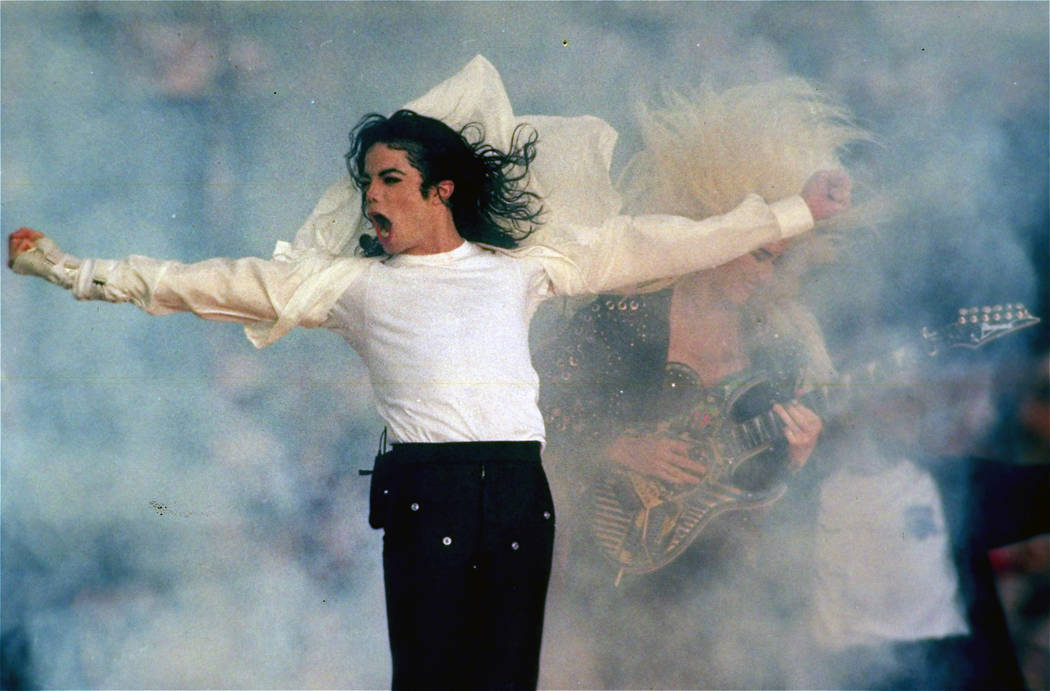 In this Jan. 31, 1993 file picture, Michael Jackson performs during the halftime show at the Super Bowl XXVII in Pasadena, Calif. The Super Bowl show can easily be divided into two eras: before an ...