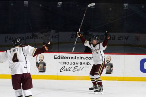 Faith Lutheran's Matty Johnson (8) celebrates with his teammate Colton Fleitz (4) after Johnson scored a goal against Utah's goaltender during the first period of a hockey game at the City Nationa ...