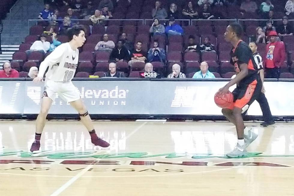 Chaparral's Elijah Briggs, right, is guarded by Elko's Sean Klekas in the Class 3A state semifinals at Orleans Arena on Friday, March 1, 2019. Elko won 53-47. (Damon Seiters/Las Vegas Review-Journal)