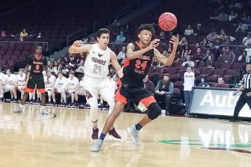 Chaparral's Sameal Anderson grabs a loose ball as Elko's Alex Klekas defends in the Class 3A state semifinals at Orleans Arena on Friday, March 1, 2019. Elko won 53-47. (Damon Seiters/Las Vegas Re ...