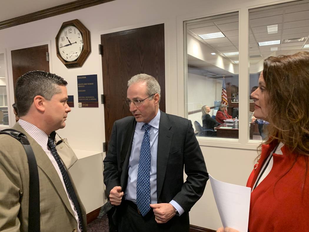 Ben Lieberman, center, an advocate for tougher distracted driving laws, speaks to Nevada Assemblyman Steve Yeager, D-Las Vegas, following a bill hearing Friday. Assemblywoman Michelle Gorelow, D-L ...