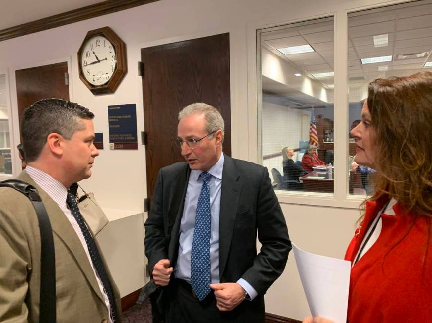 Ben Lieberman, center, an advocate for tougher distracted driving laws, speaks to Nevada Assemblyman Steve Yeager, D-Las Vegas, following a bill hearing Friday, March 1, 2019. Assemblywoman Michel ...