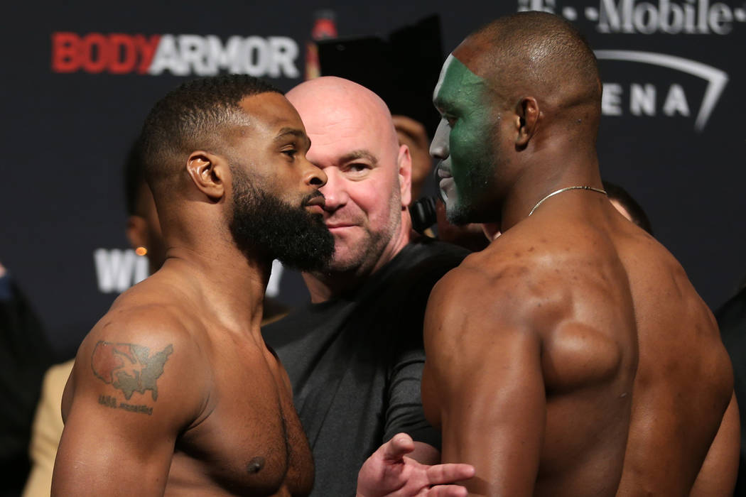 Tyron Woodley, left, and Kamaru Usman, pose during the ceremonial UFC 235 weigh-in event at T-Mobile Arena in Las Vegas, Friday, March 1, 2019. (Erik Verduzco/Las Vegas Review-Journal) @Erik_Verduzco