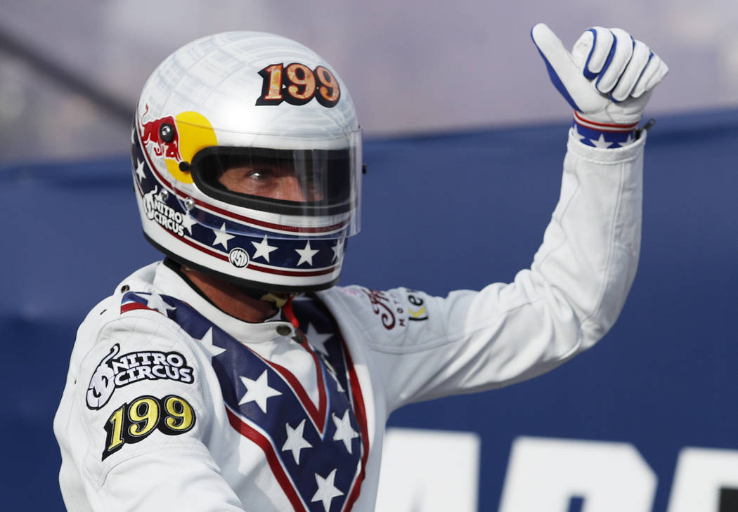 Travis Pastrana celebrates after jumping a row of crushed cars on a motorcycle Sunday, July 8, 2018, in Las Vegas. Pastrana is attempting to recreate three of Evel Knievel's iconic motorcycle jump ...