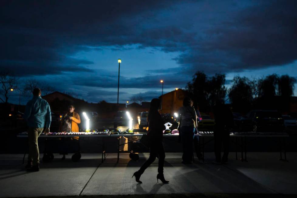 Vendors sell merchandise outside of a campaign rally for U.S. Sen. Kamala Harris, D-Calif., a Democratic presidential hopeful, at Canyon Springs High School in North Las Vegas on Friday, March 1, ...