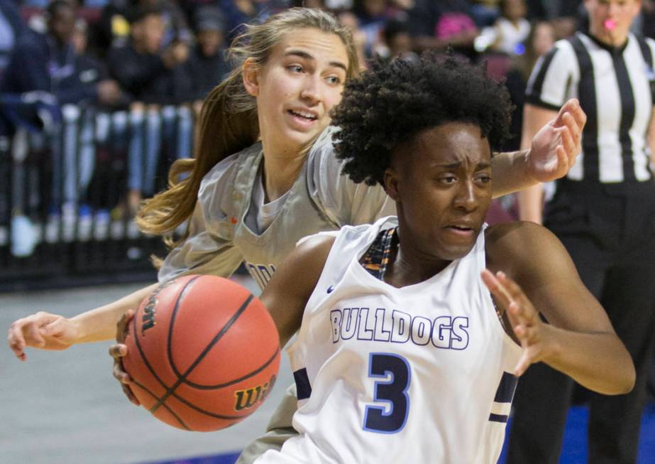 Centennial senior Quinece Hatcher (3) drives baseline past Bishop Gorman senior Lexi Kruljac (22) in the first quarter of the Class 4A girls state championship game on Friday, March 1, 2019, at Or ...