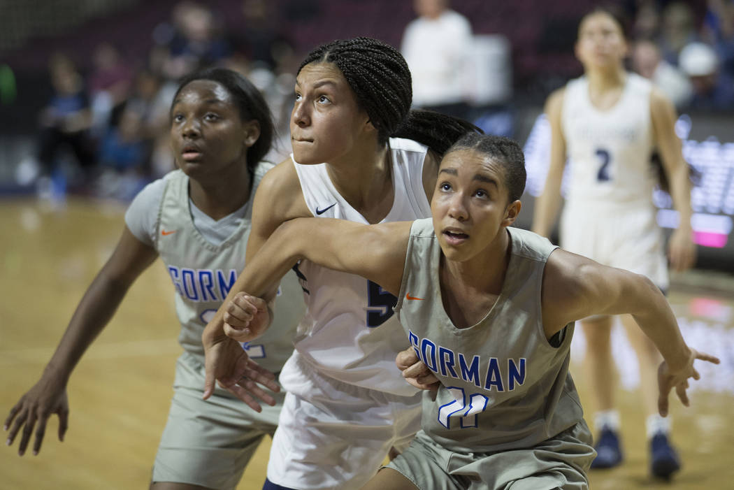 Bishop Gorman senior Olivia Smith (11) boxes out Centennial junior Jade Thomas (5) in the second quarter of the Class 4A girls state championship game on Friday, March 1, 2019, at Orleans Arena, i ...