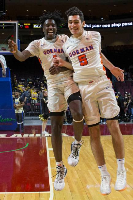 Bishop Gorman sophomore guard Will McClendon (1) and junior Mohammad Judeh Khalaf (5) celebrate after beating Clark 68-60 to win the Class 4A boys state championship on Friday, March 1, 2019, at O ...