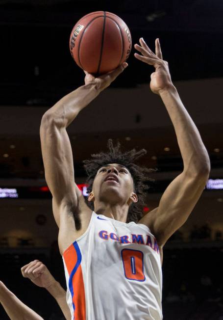 Bishop Gorman junior forward Isaiah Cottrell (0) converts a fast-break layup in the fourth quarter during the Gaels Class 4A boys state championship game with Clark on Friday, March 1, 2019, at Or ...