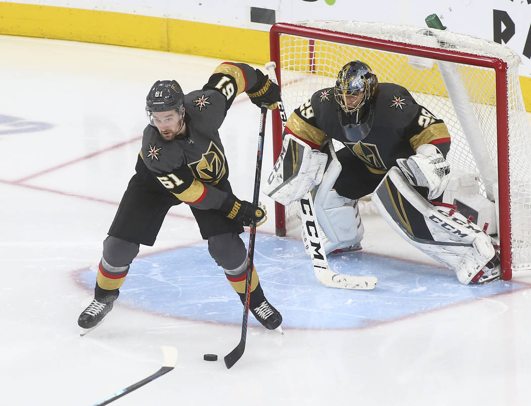 Golden Knights right wing Mark Stone (61) moves the puck in front of goaltender Marc-Andre Fleury (29) during the third period of an NHL hockey game against the Dallas Stars at T-Mobile Arena in L ...