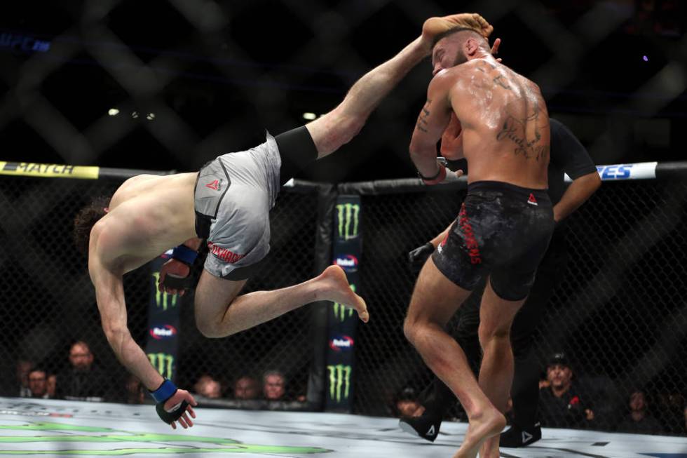 Zabit Magomedsharipov, left, leaps for a kick against Jeremy Stephens in the featherweight bout during UFC 235 at T-Mobile Arena in Las Vegas, Saturday, March 2, 2019. Magomedsharipov won by unani ...