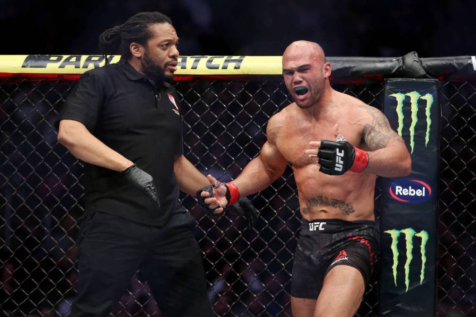 Robbie Lawler, right, protests his submission lost against Ben Askren in the first round of the welterweight bout during UFC 235 at T-Mobile Arena in Las Vegas, Saturday, March 2, 2019. (Erik Verd ...