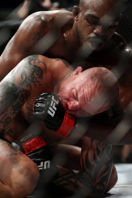 Jon Jones, top, battles Anthony Smith in the light heavyweight title bout during UFC 235 at T-Mobile Arena in Las Vegas, Saturday, March 2, 2019. Jones won by unanimous decision. (Erik Verduzco/La ...