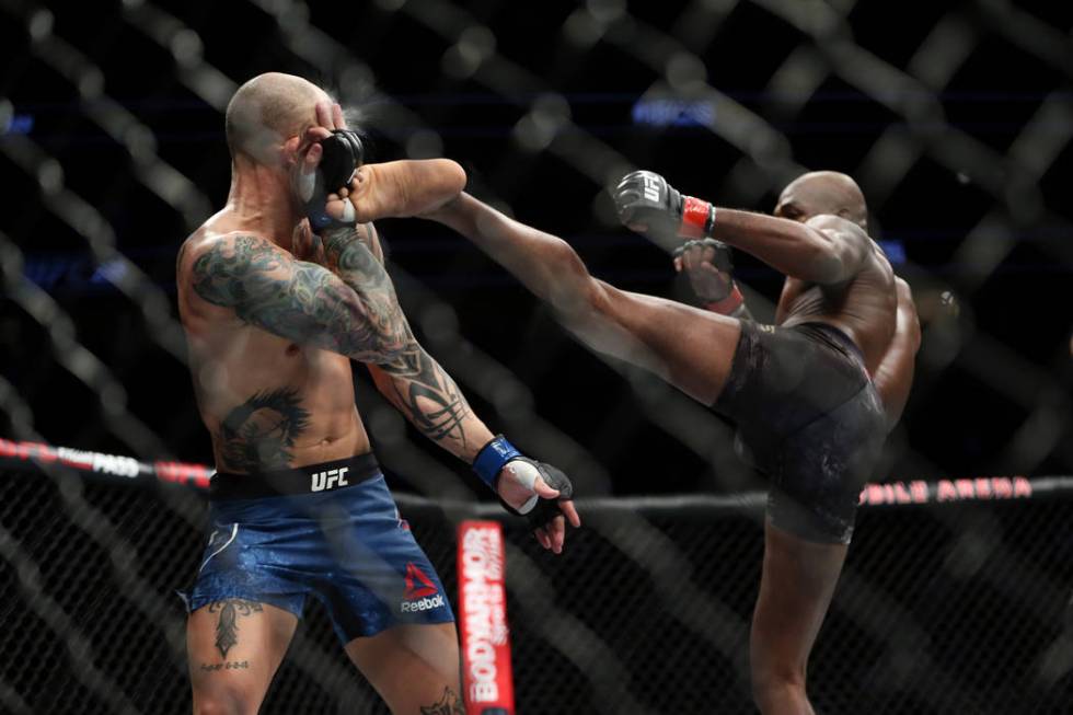 Jon Jones, right, kicks against Anthony Smith in the light heavyweight title bout during UFC 235 at T-Mobile Arena in Las Vegas, Saturday, March 2, 2019. Jones won by unanimous decision. (Erik Ver ...