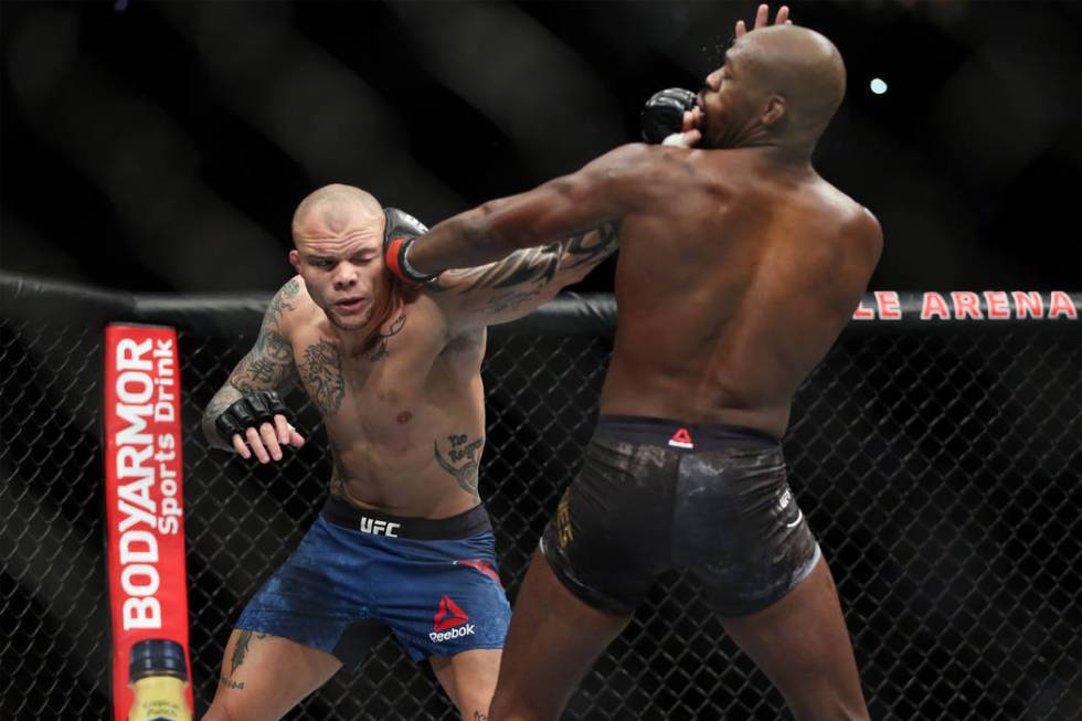 Anthony Smith, left, battles Jon Jones in the light heavyweight title bout during UFC 235 at T-Mobile Arena in Las Vegas, Saturday, March 2, 2019. Jones won by unanimous decision. (Erik Verduzco/L ...