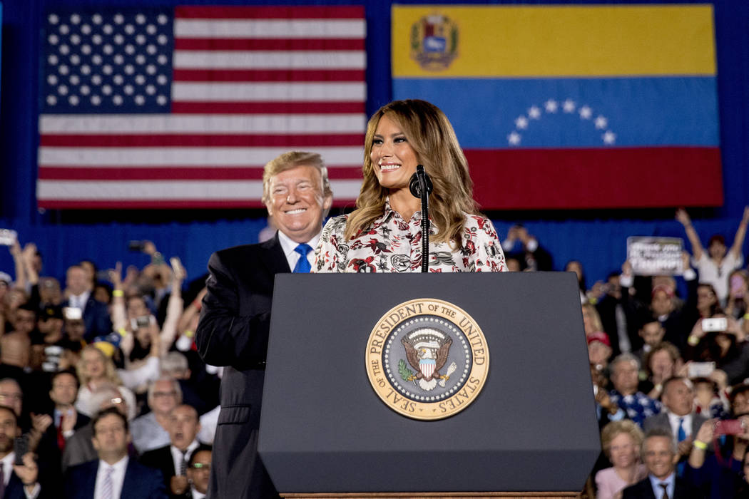 First lady Melania Trump, accompanied by President Donald Trump, smiles as she speaks in front of a Venezuelan American community at Florida Ocean Bank Convocation Center at Florida International ...