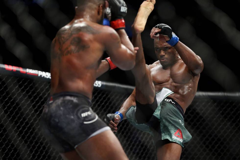 Kamaru Usman kicks Tyron Woodley in the welterweight title bout during UFC 235 at T-Mobile Arena in Las Vegas, Saturday, March 2, 2019. Usman won by unanimous decision. (Erik Verduzco/Las Vegas Re ...