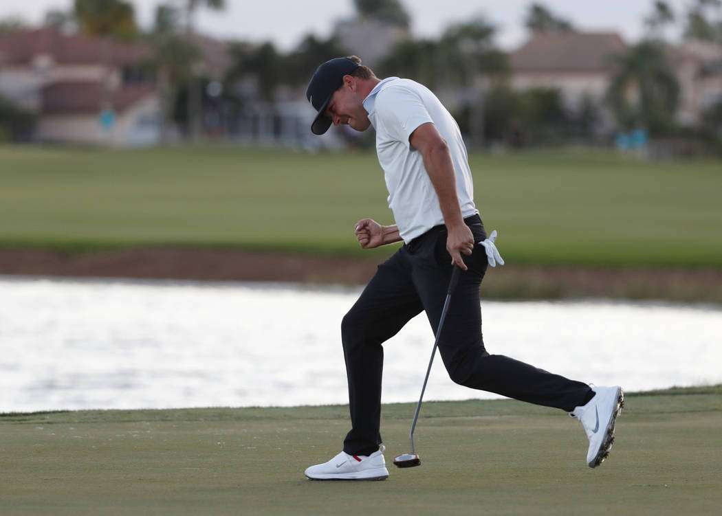 Keith Mitchell celebrates as he sinks his putt on the 18th hole to win the final round of the Honda Classic golf tournament, Sunday, March 3, 2019, in Palm Beach Gardens, Fla. (AP Photo/Wilfredo Lee)