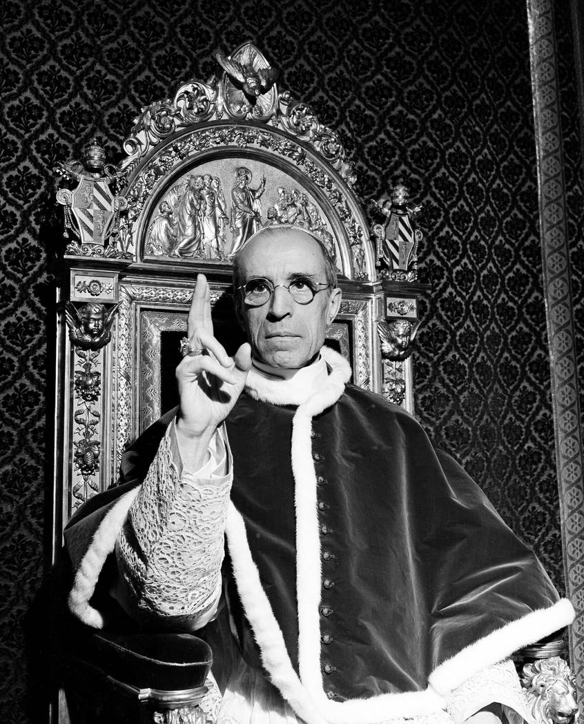 Pope Pius XII, wearing the ring of St. Peter, raises his right hand in a papal blessing at the Vatican in September 1945. Pope Francis said Monday, March 4, 2019 he has decided to open up to resea ...