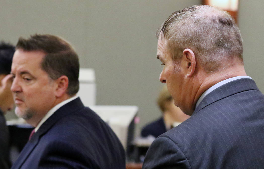 A former Las Vegas Fire Capt. Richard Loughry, 48, right, and his attorney Craig Hendricks leave the courtroom at the Regional Justice Center on Monday, March 4, 2019, in Las Vegas. Loughry plead ...