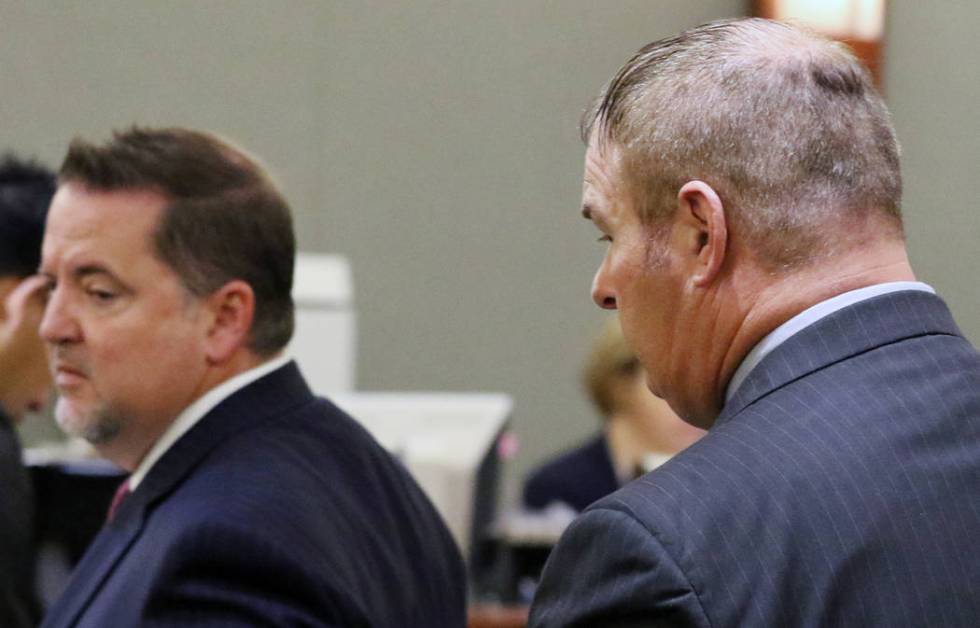A former Las Vegas Fire Capt. Richard Loughry, 48, right, and his attorney Craig Hendricks leave the courtroom at the Regional Justice Center on Monday, March 4, 2019, in Las Vegas. Loughry plead ...