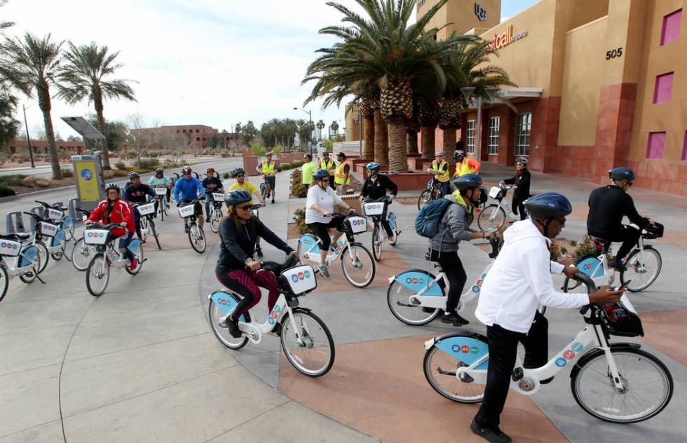 Cyclists set out from a Regional Transportation Commission Bike Share station near the Clark County Government Center on Monday, March 12, 2018, for a bike ride through historic West Las Vegas. (K ...