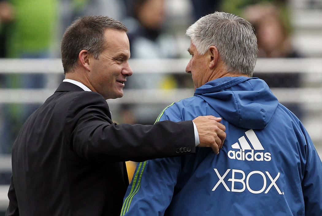 Seattle Sounders head coach Sigi Schmid, right, and Cal FC head coach Eric Wynalda chat before a U.S. Open Cup fourth-round soccer game Tuesday, June 5, 2012, in Tukwila, Wash. (AP Photo/Elaine Th ...