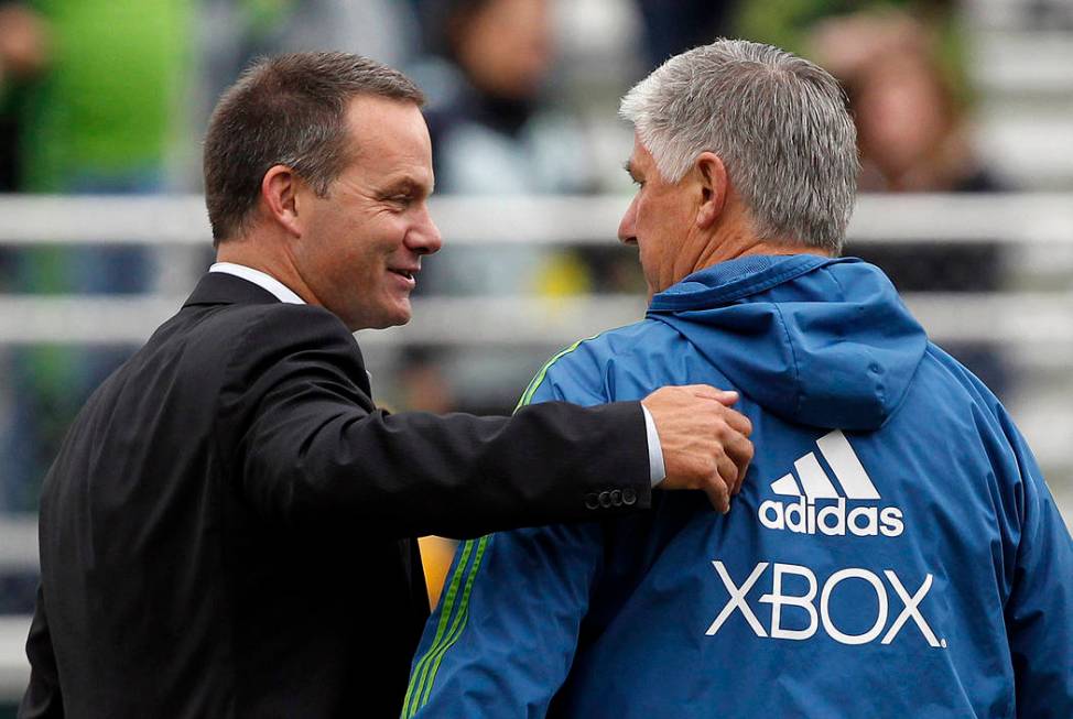 Seattle Sounders head coach Sigi Schmid, right, and Cal FC head coach Eric Wynalda chat before a U.S. Open Cup fourth-round soccer game Tuesday, June 5, 2012, in Tukwila, Wash. (AP Photo/Elaine Th ...