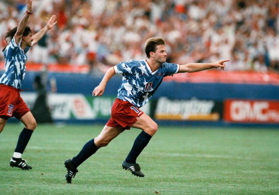 United States national team forward Eric Wynalda, right, reacts after he scored against Switzerland in a World Cup soccer championship Group A first-round match at the Pontiac, Mich., Silverdome o ...