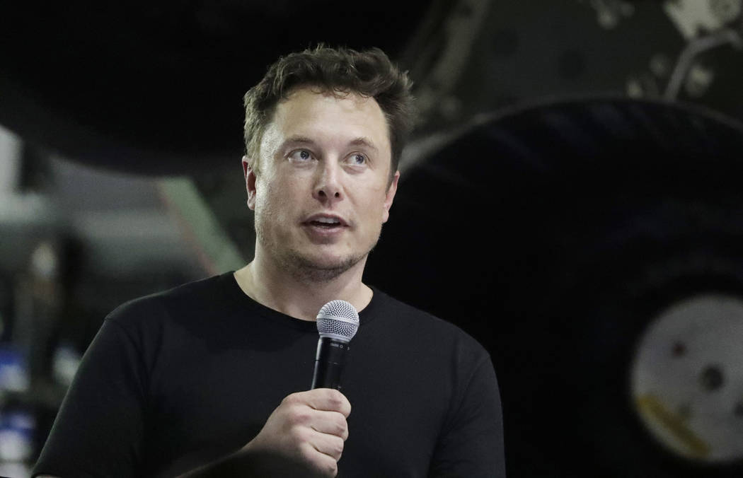 FILE - In this Sept. 17, 2018, file photo SpaceX founder and chief executive Elon Musk speaks in Hawthorne, Calif. Musk says he's planning to offer the public free rides through a tunnel he bored ...