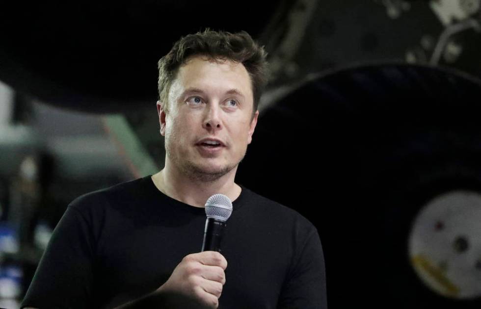 FILE - In this Sept. 17, 2018, file photo SpaceX founder and chief executive Elon Musk speaks in Hawthorne, Calif. Musk says he's planning to offer the public free rides through a tunnel he bored ...