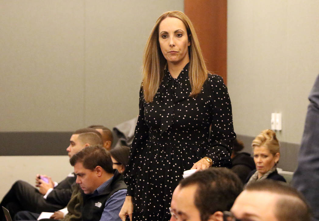 Attorney Alexis Plunkett, who prosecutors say bragged about putting a hit on her former boyfriend in prison, enters the courtroom prior to her hearing on Jan. 10, 2019, at the Regional Justice Cen ...
