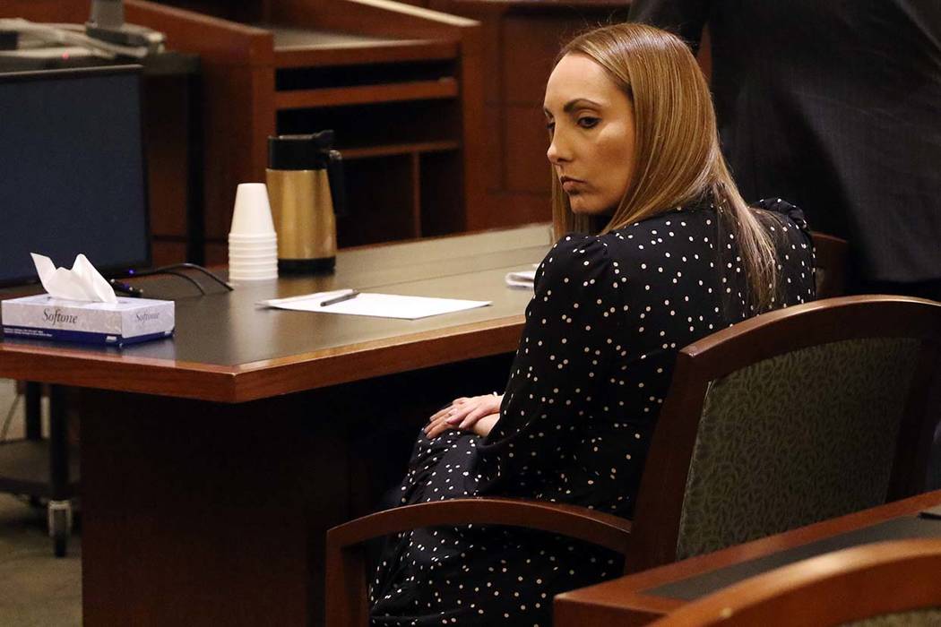 Attorney Alexis Plunkett, who prosecutors say bragged about putting a hit on her former boyfriend in prison, sits in the defendant chair during her court hearing on Jan. 10, 2019, at the Regional ...