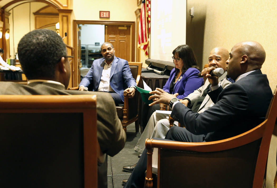 Sen. Kelvin Atkinson, right, speaks during a panel discussion on business and community in honor of Black History Month on Friday, Feb. 23, 2018, in Las Vegas, as Cedric Crear, president of Crear ...