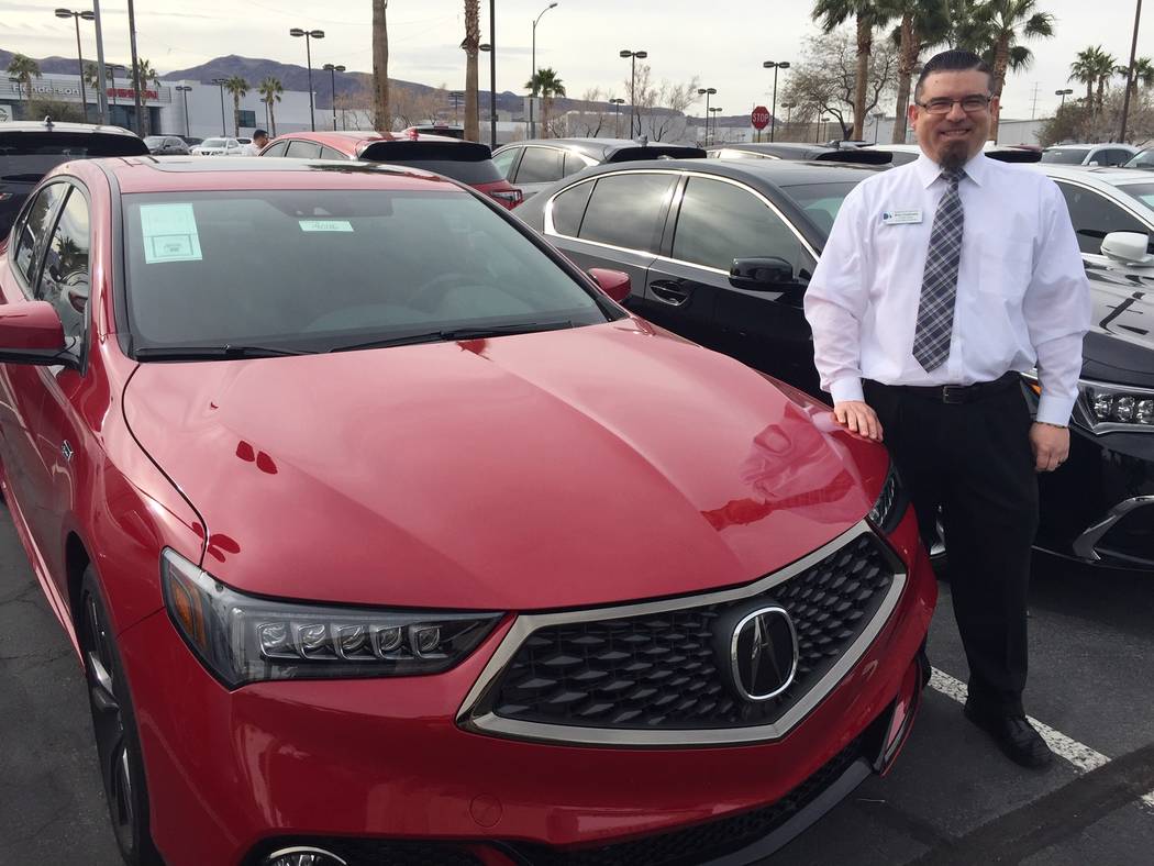 Findlay Acura sales manager Brian Castaneda stands alongside the 2019 Acura TLX A-Spec at the Valley Automall in Henderson. (Findlay)