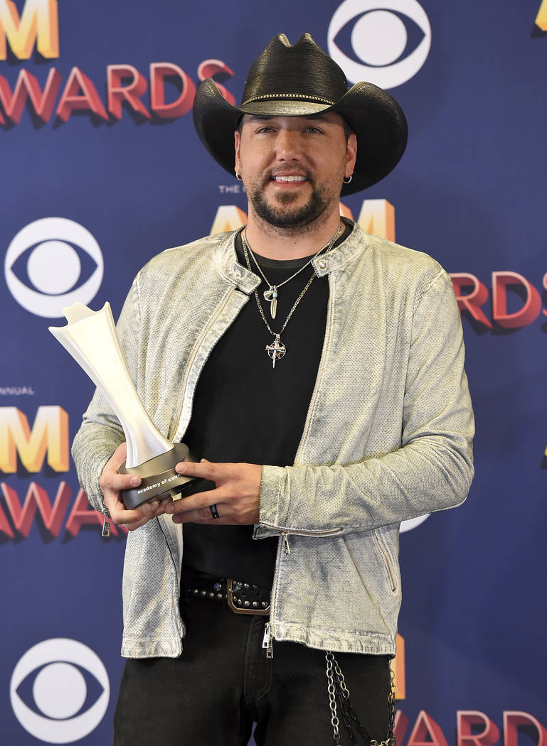 Jason Aldean poses in the press room with the award for entertainer of the year at the 53rd annual Academy of Country Music Awards at the MGM Grand Garden Arena on Sunday, April 15, 2018, in Las V ...