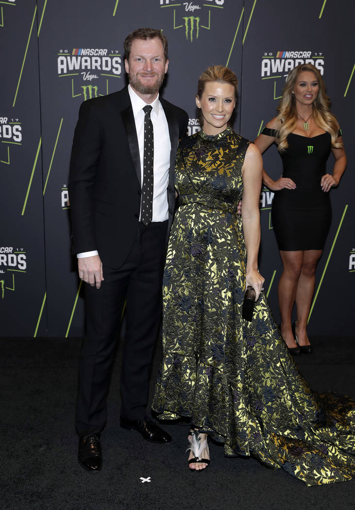 Dale Earnhardt Jr., left, and Amy Earnhardt arrive at the NASCAR Cup Series auto racing awards Thursday, Nov. 30, 2017, in Las Vegas. (AP Photo/Isaac Brekken)